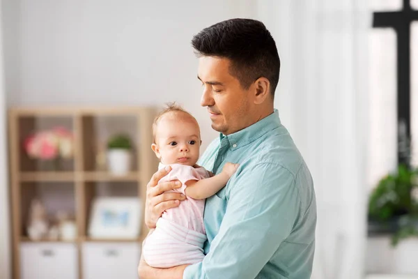 Middle aged father with baby daughter at home — Stock Photo, Image