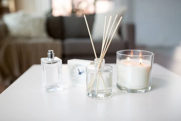 Aroma reed diffuser, burning candle and perfume — Stock Photo, Image