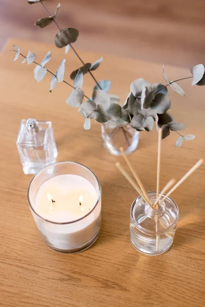 Aroma reed diffuser, burning candle and perfume — Stock Photo, Image