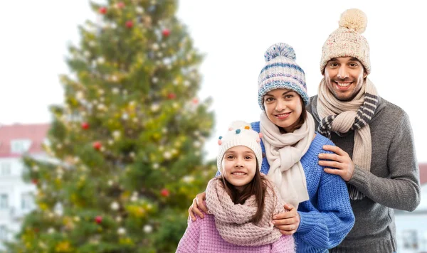 Happy family over christmas tree in tallinn — Stock Photo, Image