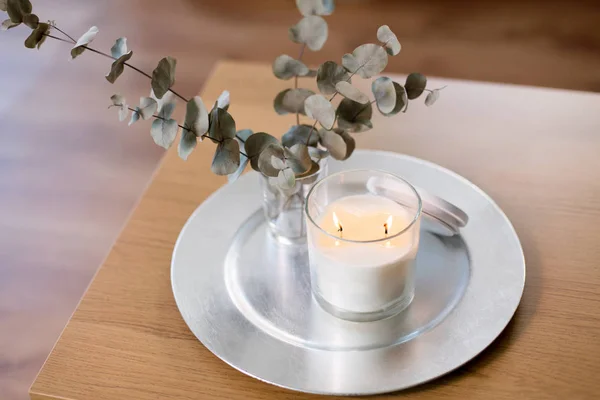 Burning white candles on table at cozy home — Stock Photo, Image