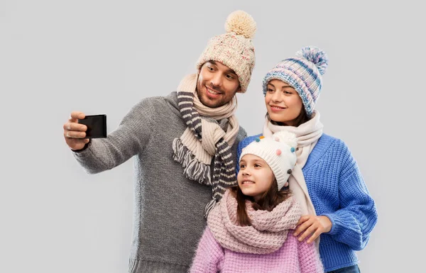 Happy family taking selfie by smartphone — Stock Photo, Image