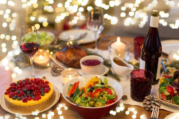 Food and drinks on christmas table at home — Stock Photo, Image