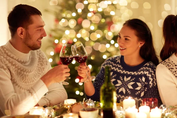Happy couple celebrating christmas at home feast — Stock Photo, Image