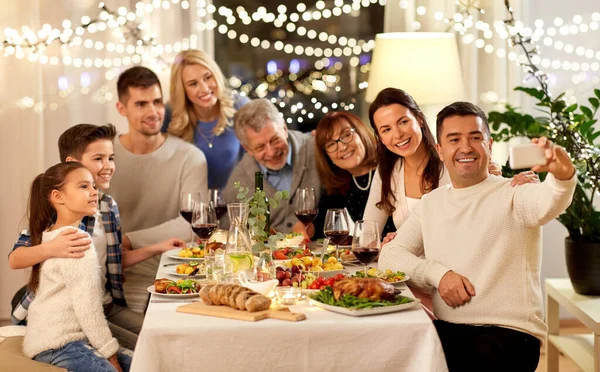 Family having dinner party and taking selfie — Stock Photo, Image