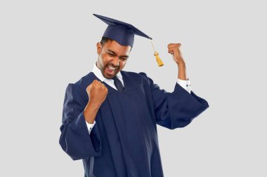 happy indian graduate student in mortar board clipart