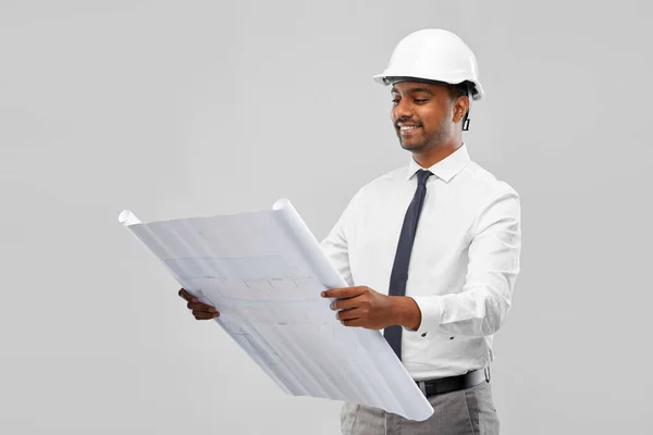 Indian male architect in helmet with blueprint — Stock Photo, Image