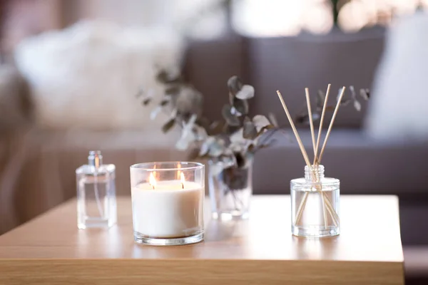 Aroma reed diffuser, burning candle and perfume — Stock Photo, Image