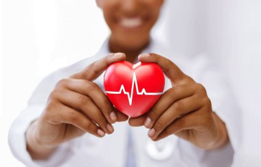 african female doctor with red heart and ecg line clipart