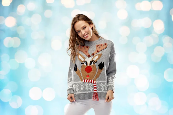 Woman in christmas sweater with reindeer pattern — Stock Photo, Image