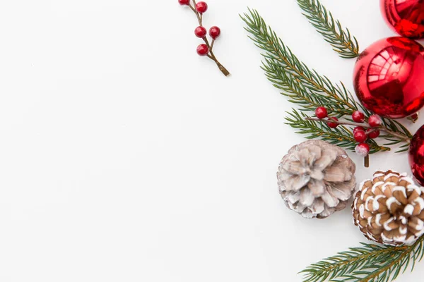 Christmas balls and fir branches with pine cones — Stock Photo, Image