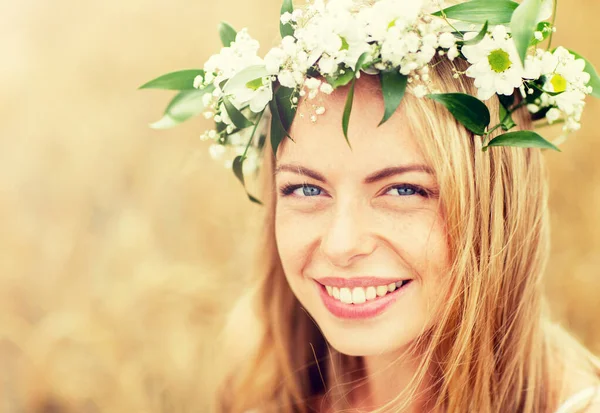 Happy woman in wreath of flowers — Stock Photo, Image