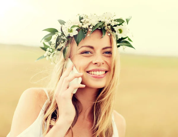 Happy young woman calling on smartphone at country — Stock Photo, Image