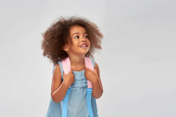 Happy little african american girl with backpack — Stock Photo, Image
