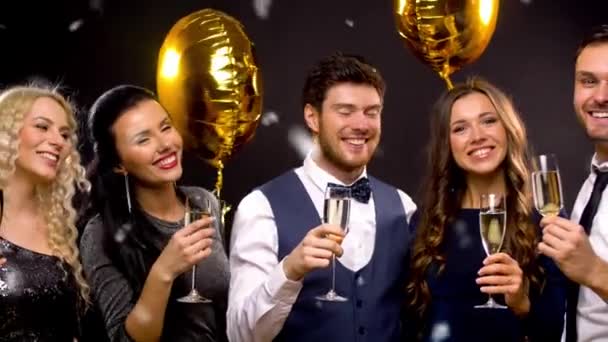 Happy friends with champagne glasses at party — Stock Video