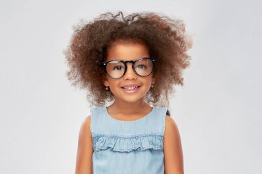 happy little african american girl in glasses clipart
