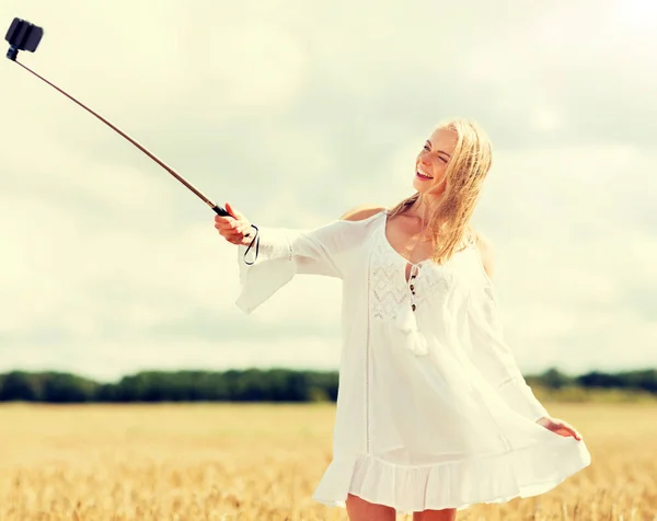 Happy young woman taking selfie by smartphone — Stock Photo, Image