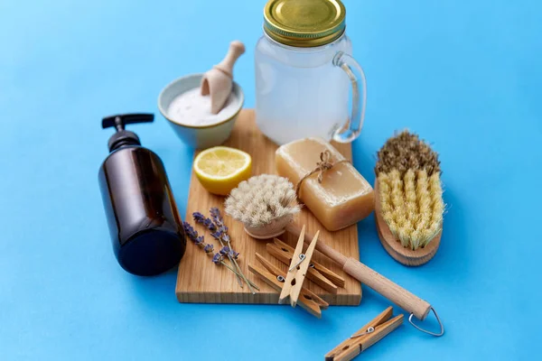 washing soda, soap, brushes, lemon and clothespins