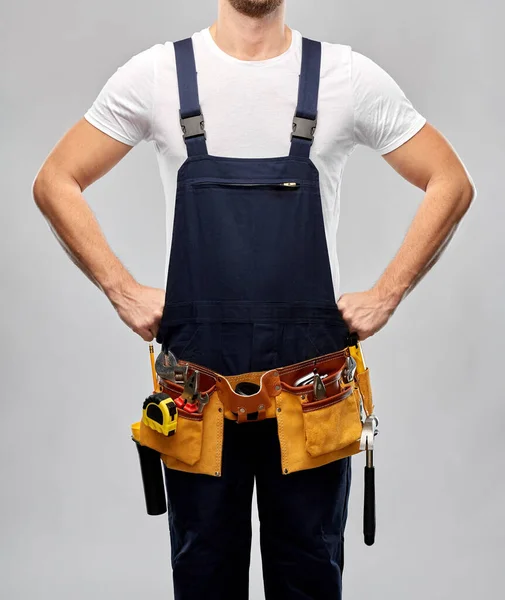 Worker or builder in overall with working tools — Stock Photo, Image