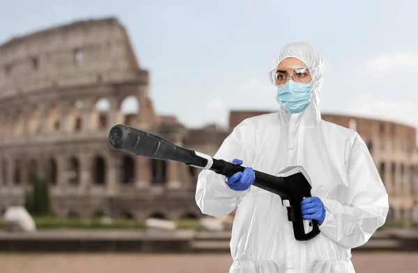 Sanitation worker in hazmat with pressure washer — Stock Photo, Image