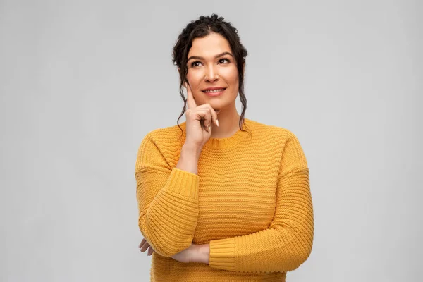 Thinking smiling young woman with pierced nose — Stock Photo, Image