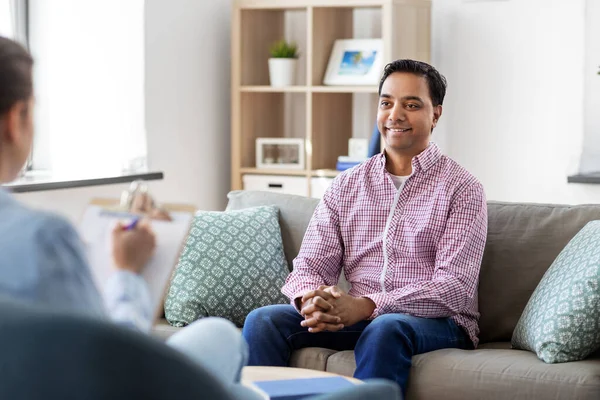 Man and psychologist at psychotherapy session — Stock Photo, Image