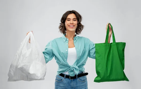 Woman with plastic and reusable shopping bag — Stock Photo, Image