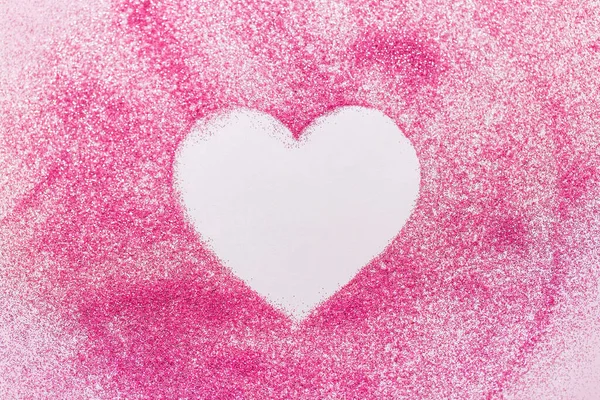 Heart shape on pink glitters on white background — Stock Photo, Image