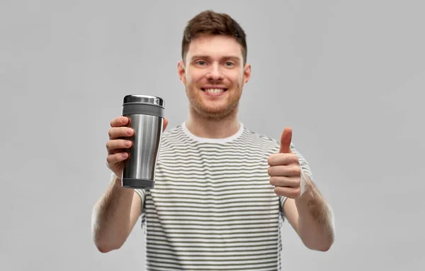 Man with thermo cup or tumbler for hot drinks — Stock Photo, Image