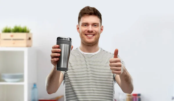 Man with thermo cup or tumbler for hot drinks — Stock Photo, Image