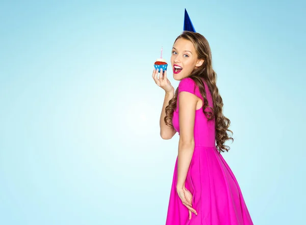 Happy woman or teen girl with birthday cupcake — Stock Photo, Image