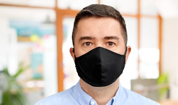 Middle-aged man in reusable face protective mask — Stock Photo, Image