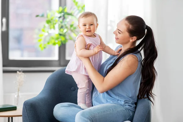 Happy mother with little baby daughter at home — Stock Photo, Image