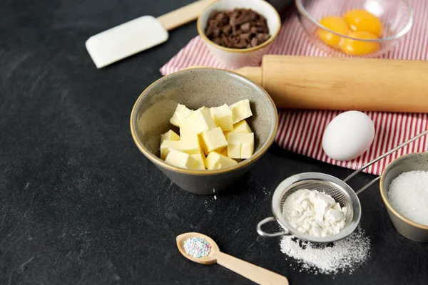 Rolling pin, butter, eggs, flour and chocolate — Stock Photo, Image