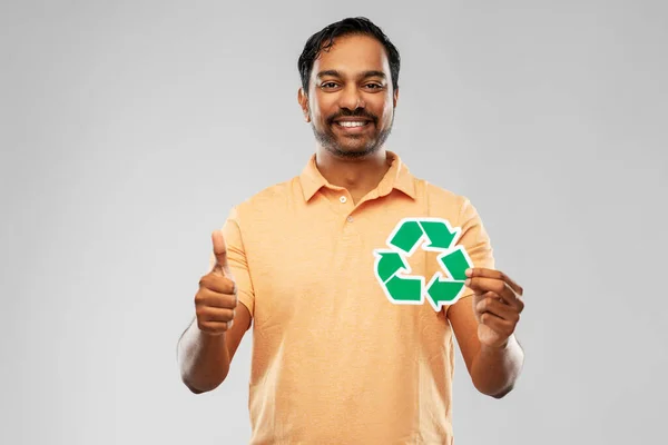 Smiling indian man holding green recycling sign — Stock Photo, Image