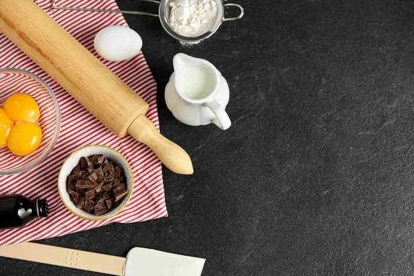 Rolling pin, milk, eggs, flour and chocolate — Stock Photo, Image