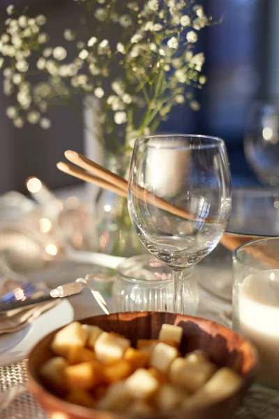 Wine glass on served dinner party table at home — Stock Photo, Image