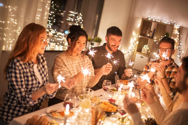 Happy friends having christmas dinner at home — Stock Photo, Image
