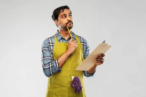 Indian gardener or farmer with clipboard thinking — Stock Photo, Image