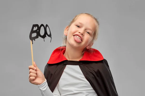 Girl in costume of dracula with cape on halloween — Stock Photo, Image