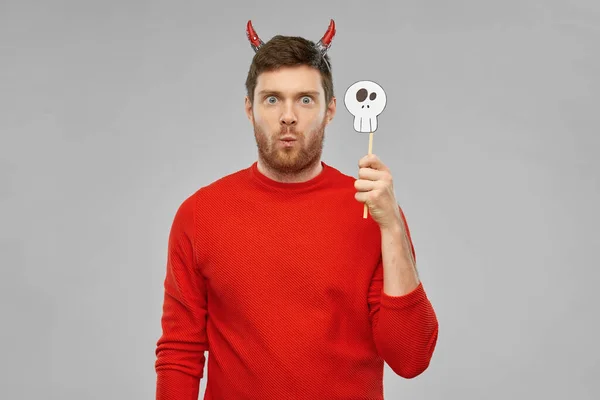 Man in halloween costume of devil over grey — Stock Photo, Image