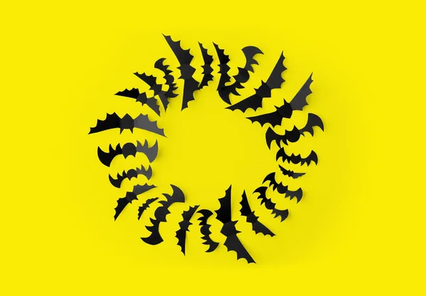 노란색 배경 위에 검은 종이 박쥐 떼 — 스톡 사진
