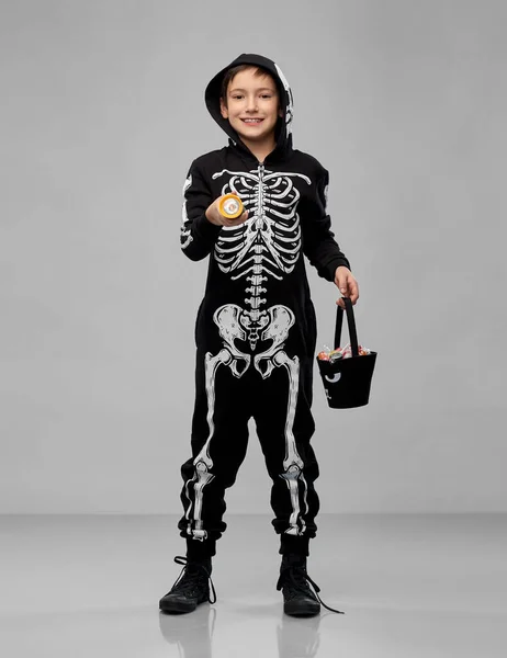 Boy with candies and flashlight on halloween — Stock Photo, Image