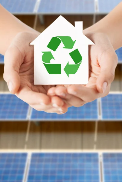 Hands holding house with recycling symbol — Stock Photo, Image