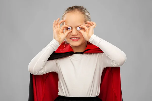 Girl in halloween costume of dracula with eyeballs — Stock Photo, Image