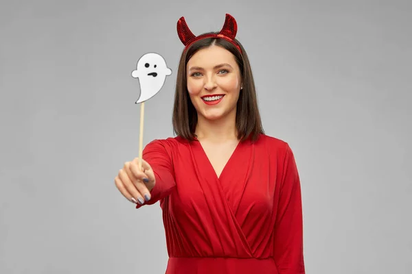 Happy woman in red halloween costume of devil Stock Picture