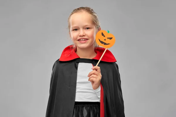 Girl in costume of dracula with cape on halloween — Stock Photo, Image