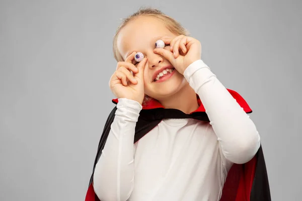 Girl in halloween costume of dracula with eyeballs — Stock Photo, Image