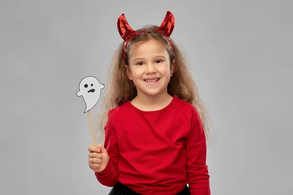 Girl in halloween costume with ghost party prop — Stock Photo, Image