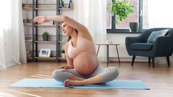 Tired pregnant woman doing sports at home — Stock Video